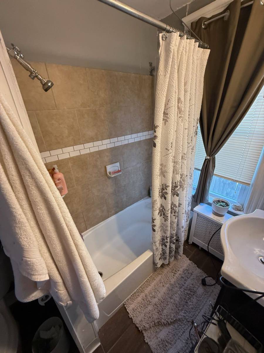 Tammy’s original tiled shower before demolition