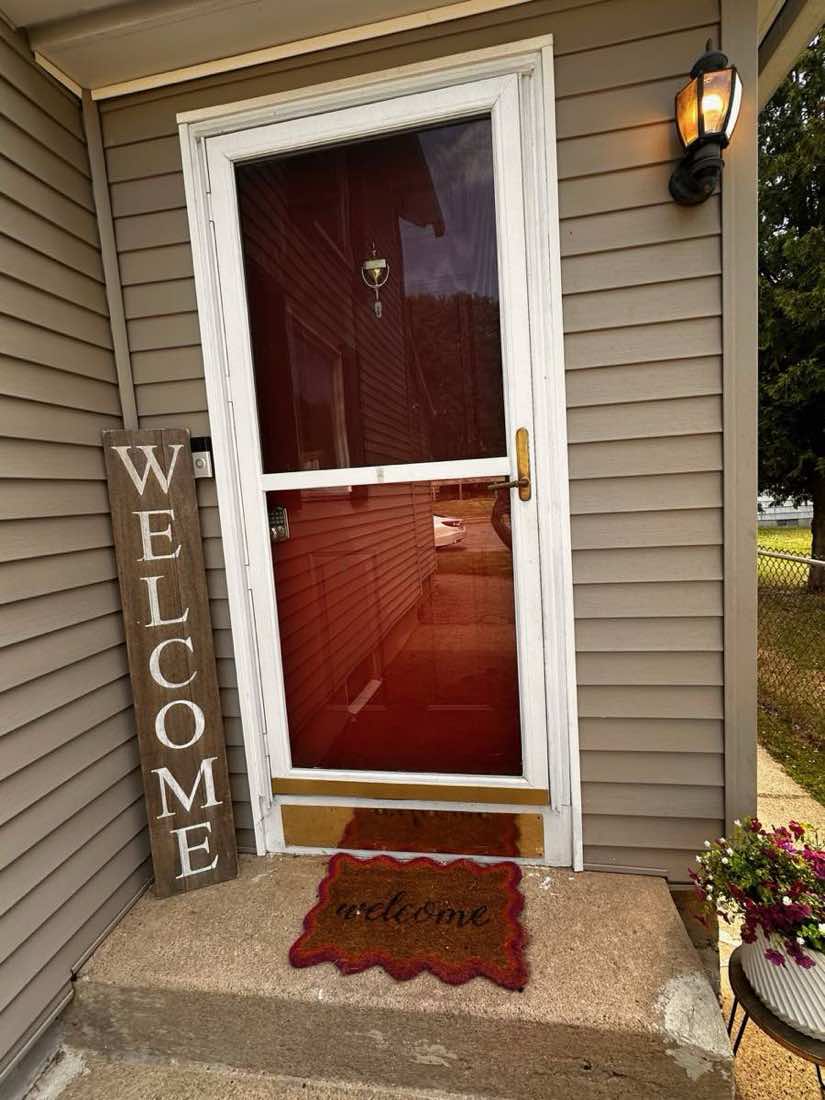 Tori’s original front entry door before replacement